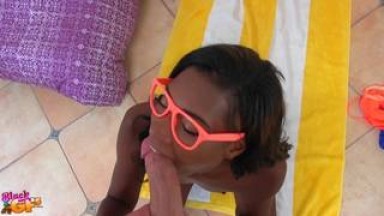 A young black woman with glasses sucking poyoa in her yoga class